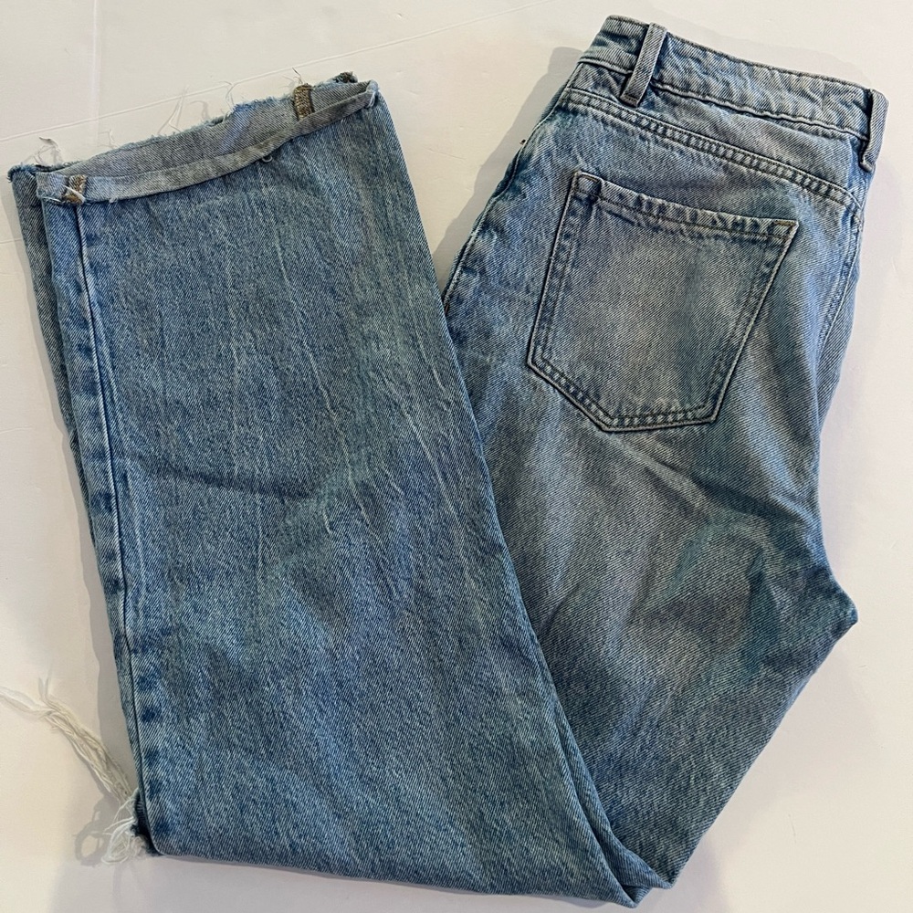 Garage ripped blue jeans